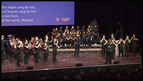 Signing Choir perform on stage at Celebrating Christmas with Strawberry Field