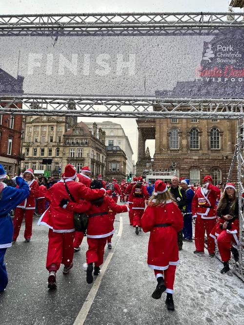People dressed up as santa take part in the Liverpool Santa Dash to raise funds for Strawberry Field