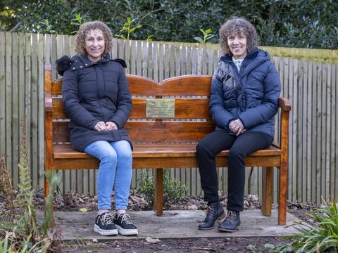 Googlebox's Leon & June Bernicoff's daughters sitting on memorial bench at Strawberry Field