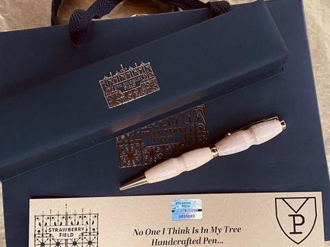 A wooden pen on gift packaging